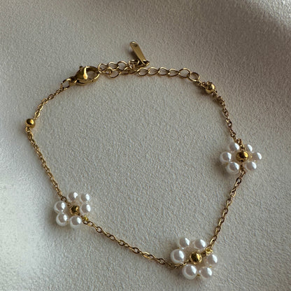 Gold plated bracelet with pearl flower charms